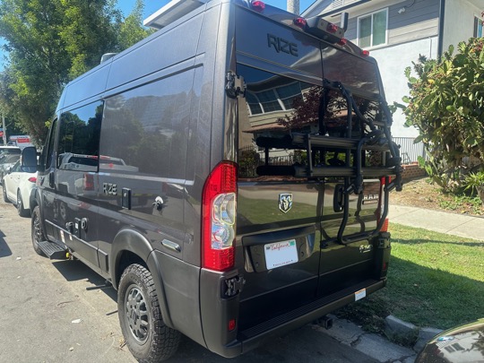 Rear driver-side three-quarter view of campervan
