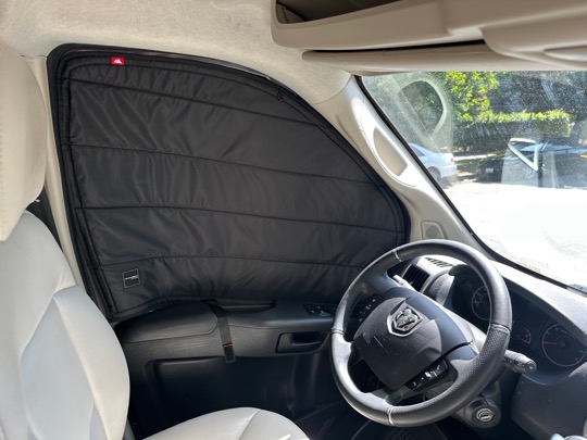 Driver side window with blackout shade from Wanderful